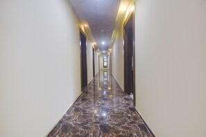 Stylish hallway leads to a door at the end.