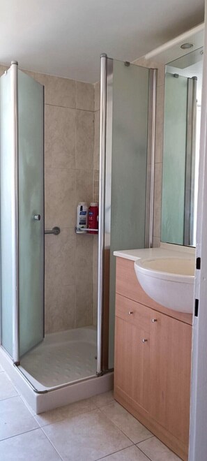 Shower, hair dryer, towels, soap