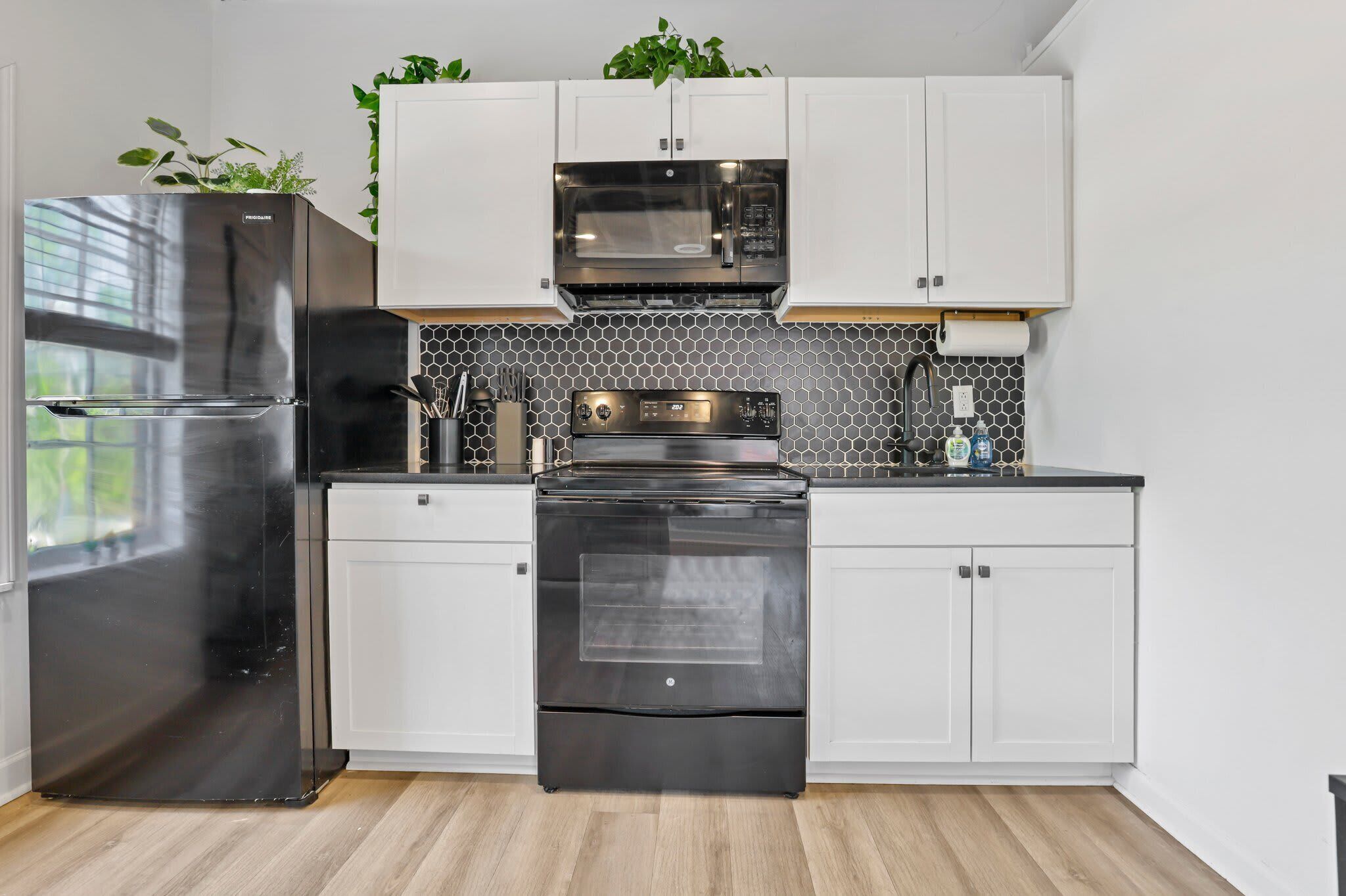 Coffee/tea maker, fridge, microwave, oven