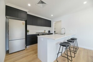 Fridge, microwave, oven, stovetop - Getaway on Curran | CBD Escape, EV Plug, Firepit (Orange)