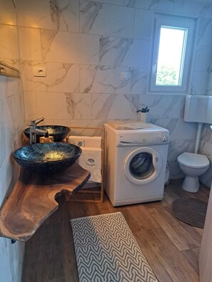 Shower, hair dryer, towels, toilet paper