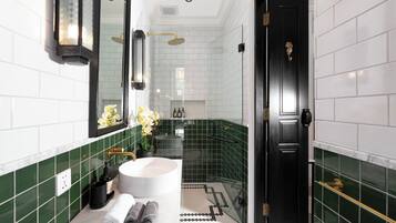 Design Villa | Bathroom | Shower, rainfall showerhead, hair dryer, towels