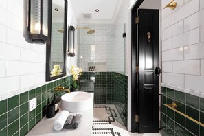 Design Villa | Bathroom | Shower, rainfall showerhead, hair dryer, towels