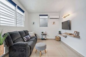 TV - Majestic City Home | Country Club 2 Bedroom Unit (San Juan)