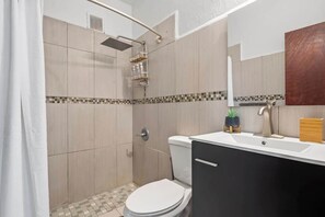 Shower, hair dryer, towels, soap - Majestic City Home | Country Club 2 Bedroom Unit (San Juan)