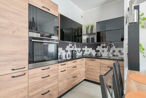 Deluxe Apartment, 1 Bedroom, Ensuite, City View | Private kitchenette | Full-sized fridge, microwave, oven, stovetop