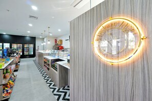 Welcome to Hotel Hill, where a central reception area offers a coffee machine and refrigerator for your convenience.