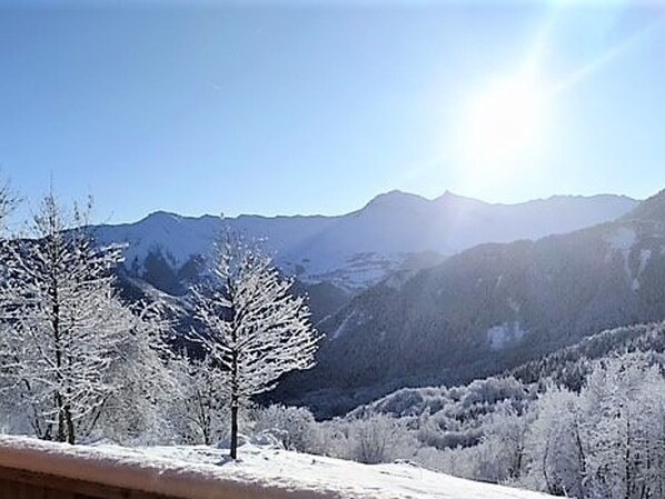 A snowy mountain landscape with clear skies.