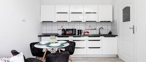 Fridge, microwave, stovetop, coffee/tea maker