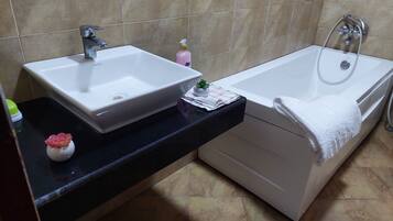 Shower, jetted tub, hair dryer, bidet