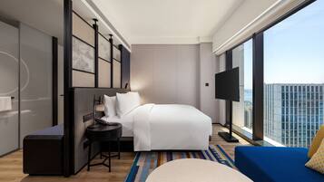 Premium bedding, down comforters, pillowtop beds, minibar