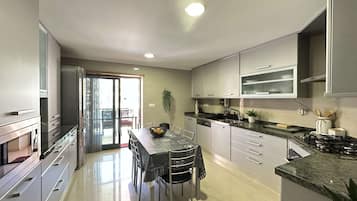 Apartment | Private kitchen | Full-size fridge, microwave, oven, stovetop