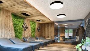A spa room with wooden walls, a green wall feature, and multiple massage chairs. - Premium mit IR-Sauna by Interhome (Fügen)