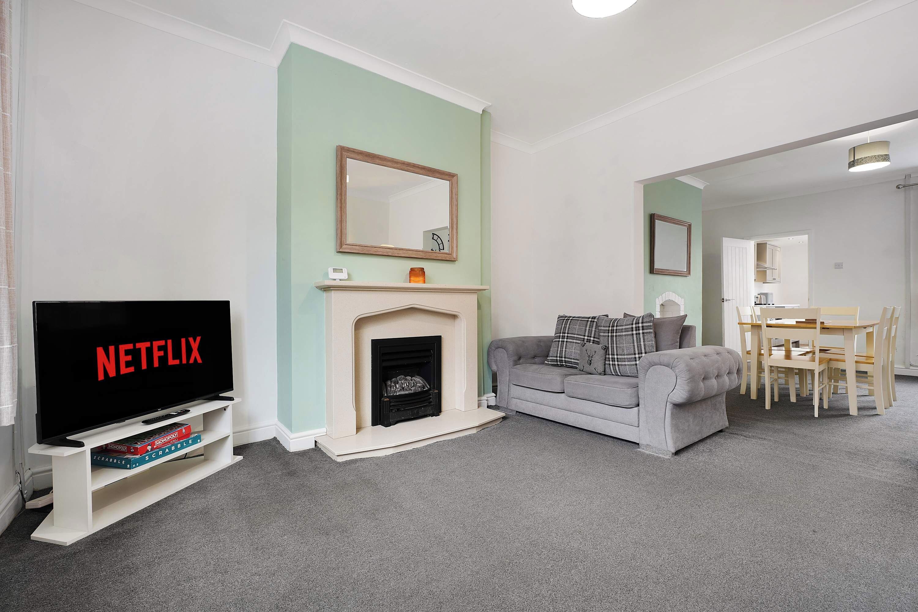 Settle into the inviting living room, with comfortable seating and a TV creating an easy setting for relaxed evenings. Enjoy a film by the fireplace, catch up over conversation, or simply unwind after a day out exploring the local area.