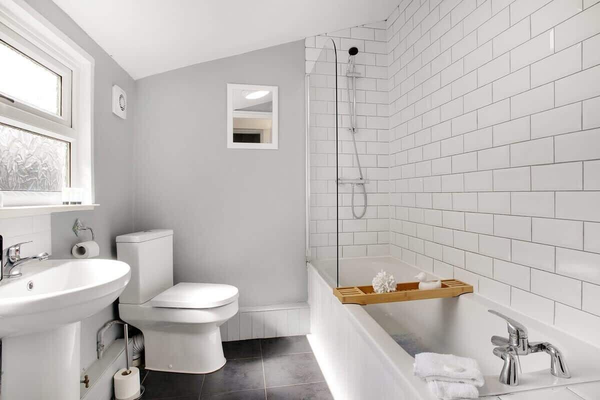 Bathtub, hair dryer, shampoo