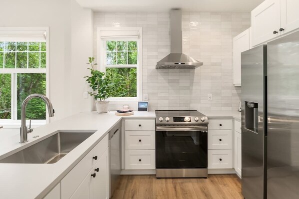 Fridge, microwave, oven, stovetop - Unit 4 One Central · Newly Remodeled Executive Home - Unit 4 (Bellevue)