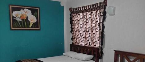 Standard Quadruple Room | Desk, laptop workspace, WiFi (free), bed sheets