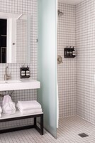 Deluxe Room | Bathroom | Hair dryer, slippers, towels