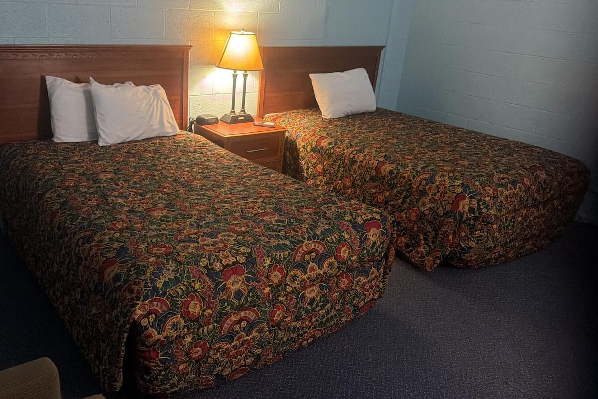 Desk, blackout drapes, WiFi (free), bed sheets