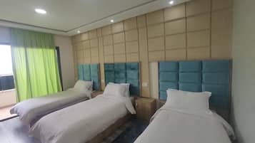 Deluxe Triple Room | 1 bedroom, individually decorated, individually furnished, desk