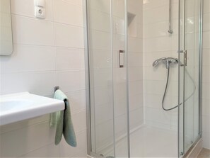 Shower, towels, soap, toilet paper