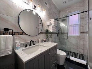 Shower, hair dryer, towels, soap