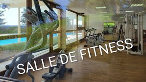 A fitness center with exercise equipment, large windows, and a view of the outdoors. - Cosy apt 4 ppl, near the ski runs (Chamrousse)