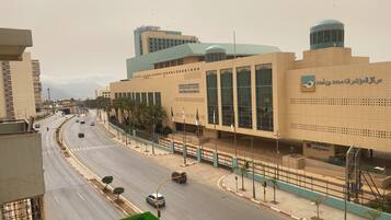 A modern building with large windows and a sign indicating it is a conference center.