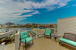 Waterfront villas offer a serene atmosphere with a deck and marina views.