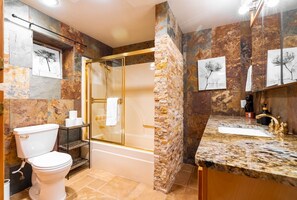 Bathtub, hair dryer, towels, soap