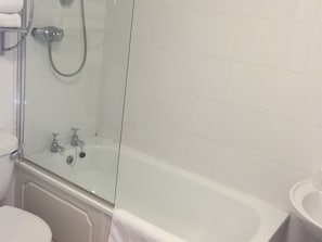 Combined shower/bathtub, towels, soap, shampoo