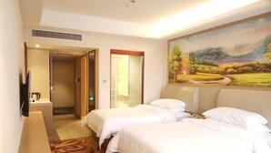 A hotel room with two beds, a television, a painting, and a carpeted floor. - Vienna Hotel Chengdu Dufu Cottage The Jinsha Site (Chengdu)