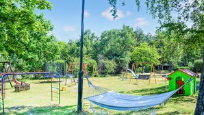 A playground with swings, slides, and a hammock. - Awesome apartment in Ustka with WiFi (Ustka)