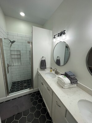 Shower, hair dryer, towels, soap