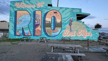 A mural with the text "Welcome to Rio Del Mar" and a depiction of a bird and landscape.