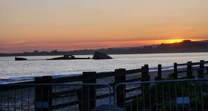 Charming single-story home steps from the beach.