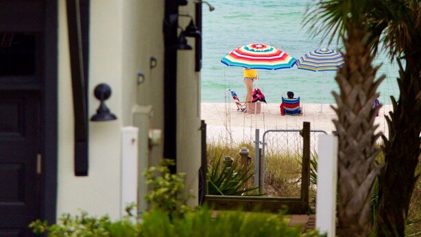A house with a balcony overlooking a beach with two umbrellas. - 6 BR Townhome Oceanvws Rooftop Deck Pool (Panama City Beach)