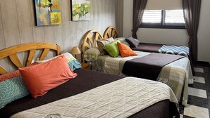 A hotel room with two single beds, wooden headboards, and a window with curtains. - Vistamar La Caleta 2 (La Caleta)