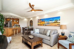 Luxury Condo | Living area | 80-inch Smart TV with digital channels, Hulu, streaming services - Elegant Oceanfront Vistas (Kihei)