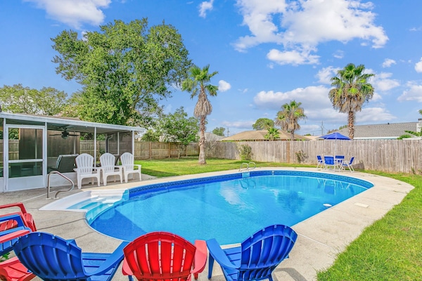 Huge private backyard complete with a private pool, screened porch, and plenty of yard for your dog