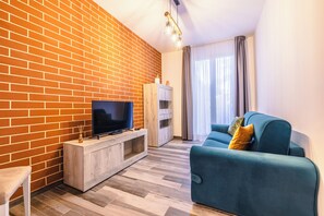 Suite Studio Luxe | Coin séjour | TV connectée