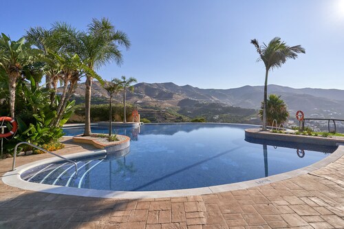 Casa de vacaciones 'Casa Palmeras' con vistas al mar, Wi-Fi y aire acondicionado