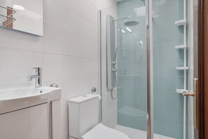 Bathtub, hair dryer, towels