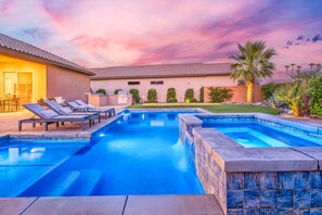A swimming pool with lounge chairs and a barbecue area. - PGA West: Your Poolside & Fire Pit Haven (La Quinta)
