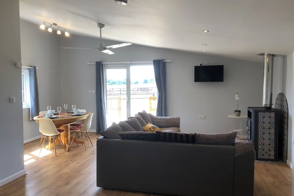 Open plan living space, two double bedrooms and sliding patio door to veranda.