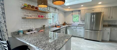 Microwave, stovetop, dishwasher, coffee/tea maker