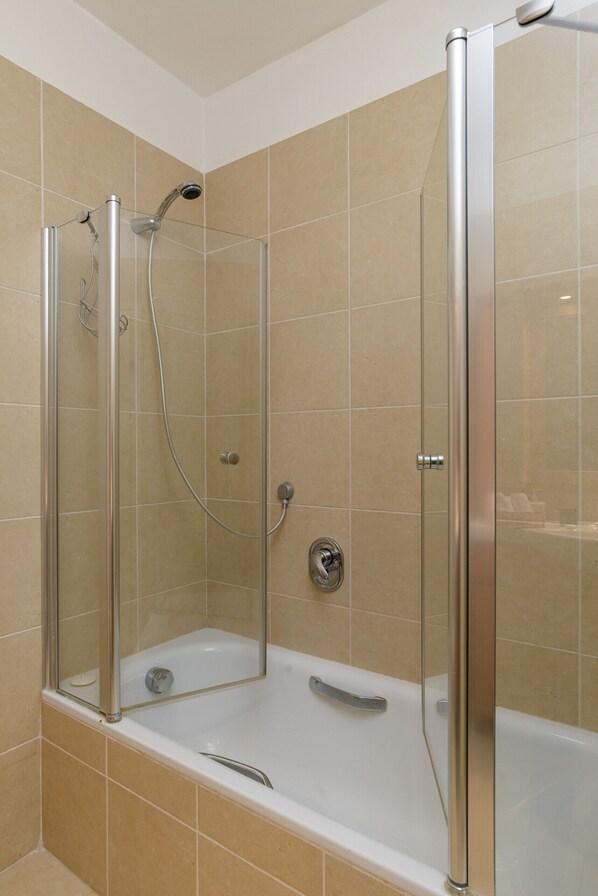 Bathtub, hair dryer, towels