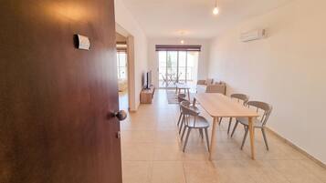 Basic Apartment | Living area | Flat-screen TV