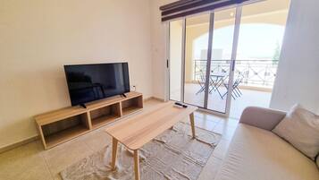 Basic Apartment | Living area | Flat-screen TV