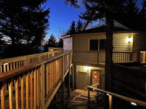 A two-story wooden structure with a balcony and a staircase leading to the upper level. - Hutch 1- 2 Min Walk to Slopes, Great Mountain View (Slaty Fork)